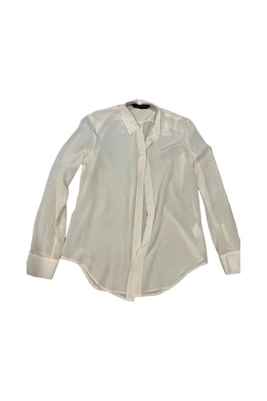 White long-sleeved button-down shirt with a classic collar, on a white background.
