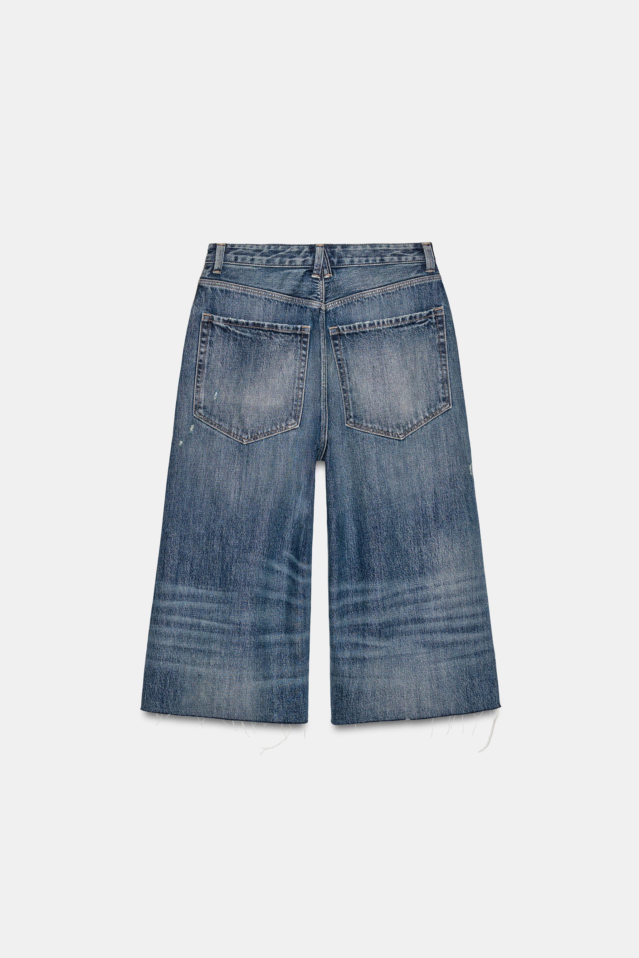 MID-RISE RIPPED DENIM JORTS