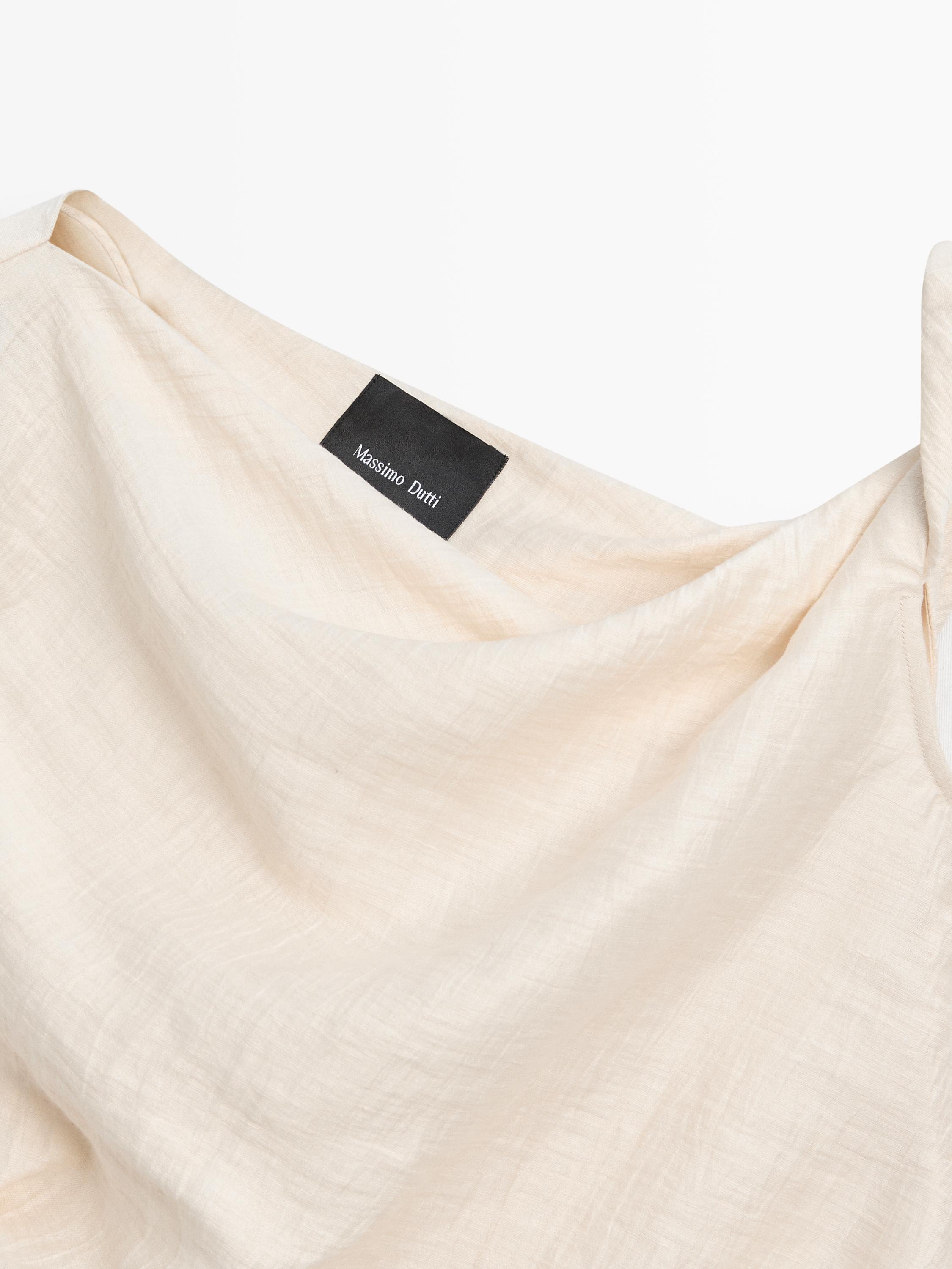 Asymmetric top with knot detail