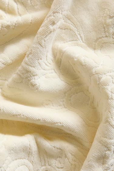 Zaras BADHANDDUK MED JACQUARDMÖNSTER OCH TOFSAR - Pastellgul