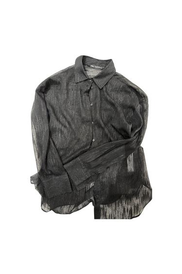 Black semi-sheer long-sleeve shirt with a shirt collar, featuring front buttons. It has a lightweight fabric with subtle shimmering threads.