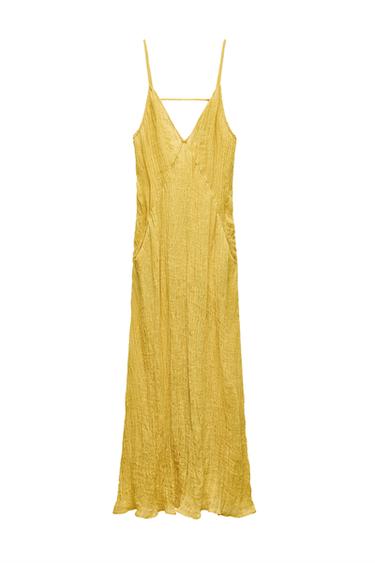 ZARA WOMAN COLLECTION<br/><br/>Long dress made of 100% linen. V-neck with spaghetti straps. Front pockets. Wrinkled fabric.