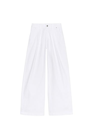 Front view of wide-leg white pants with side pockets and front button.