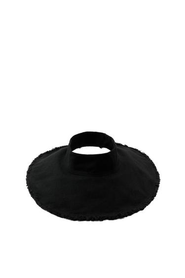 Black hat with a wide brim and frayed edge.