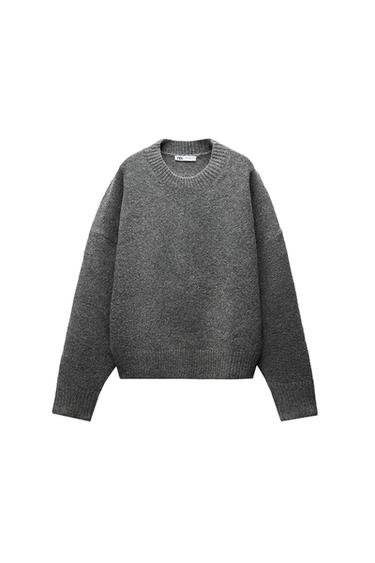 Front view of a grey crew neck jumper with long sleeves and ribbed texture.