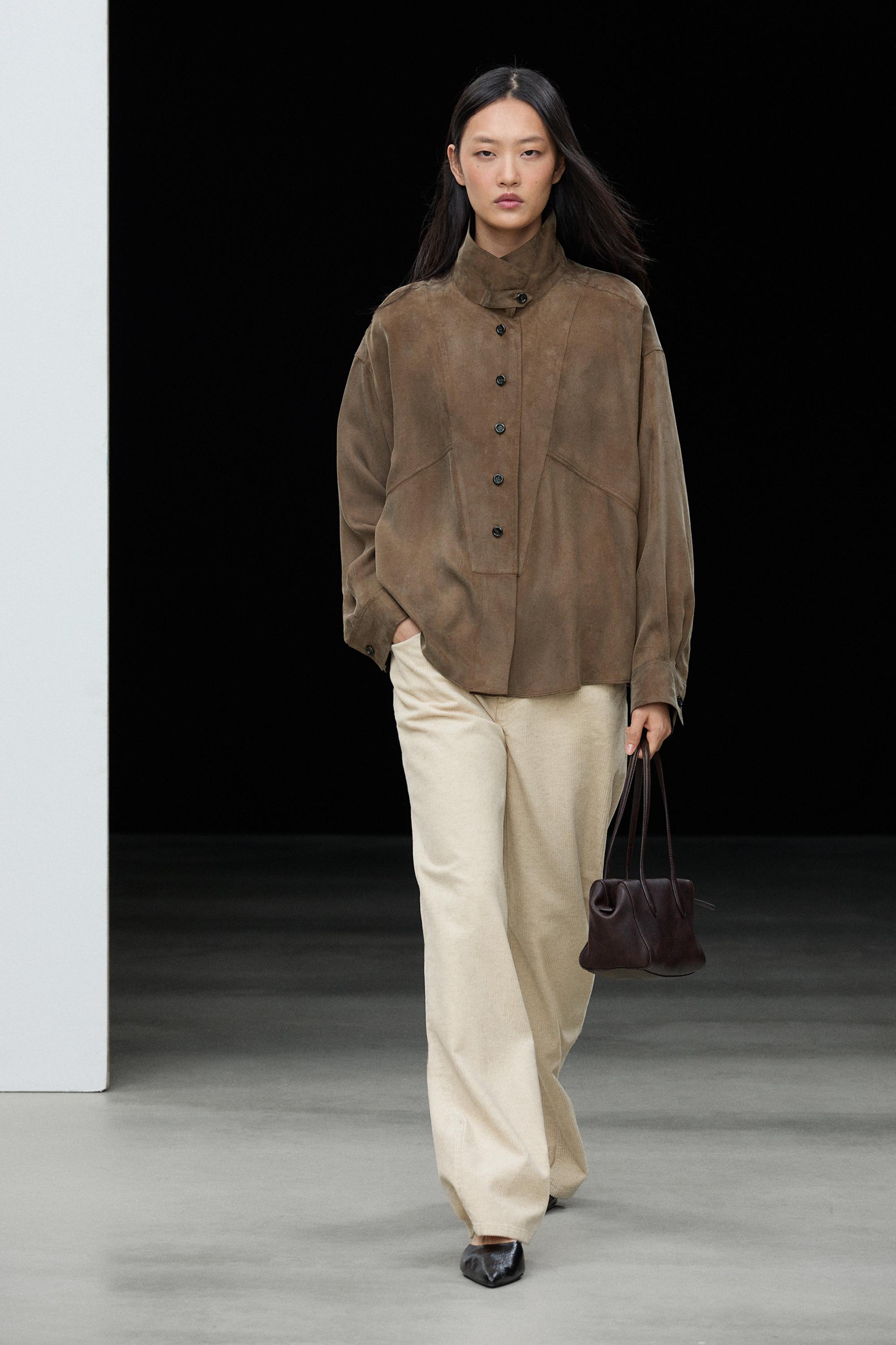 Flowing shirt with stand collar and bib detail
