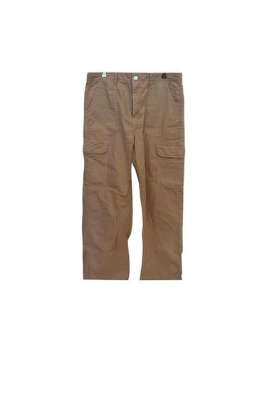 Front view of brown cargo trousers with side and front flap pockets.