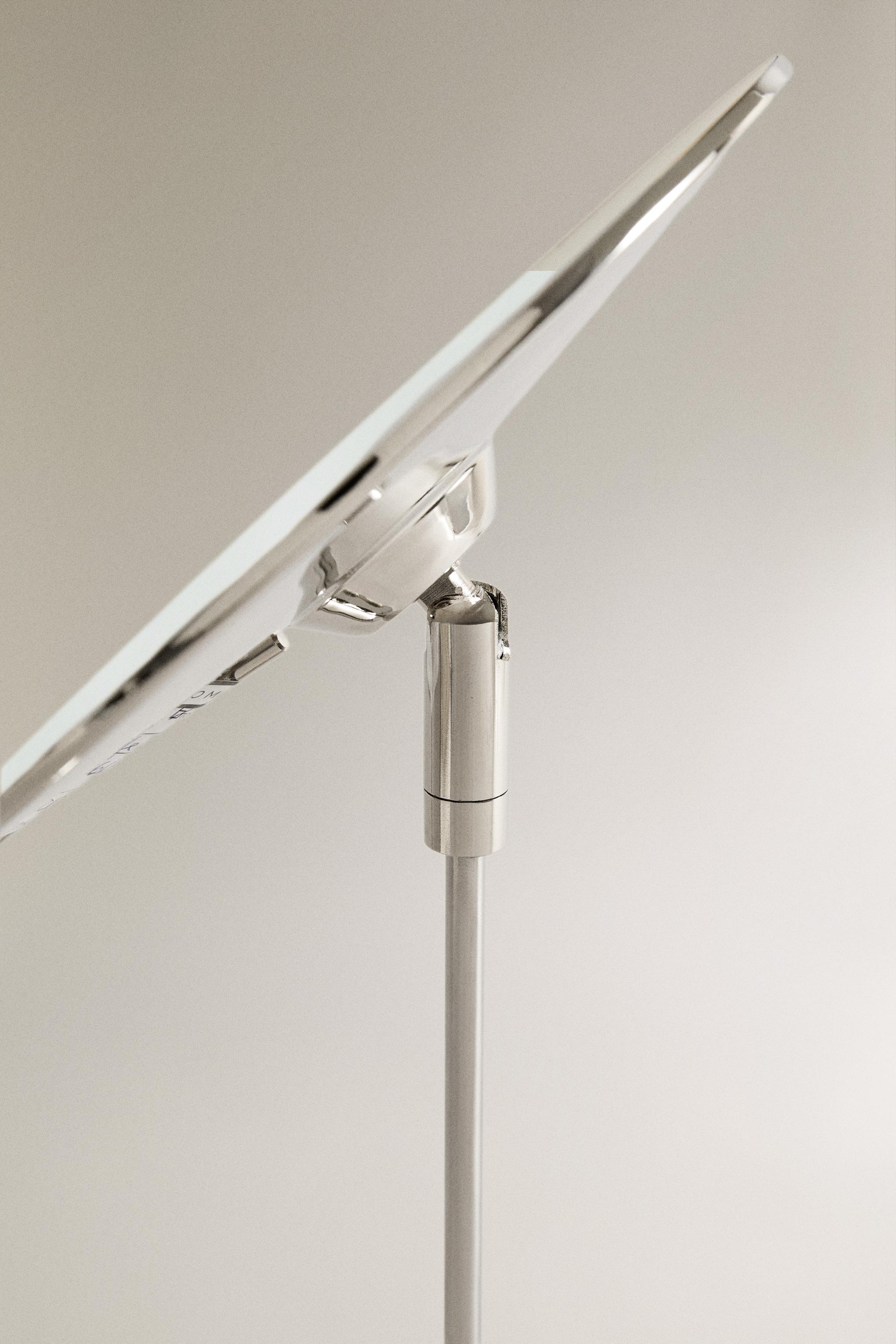 MAGNIFYING METAL MIRROR