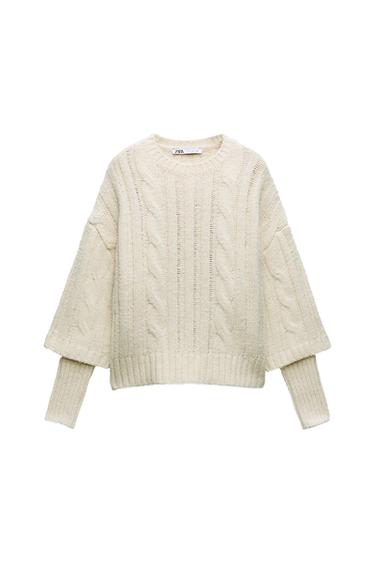 LAYERED SLEEVE CABLE KNIT SWEATER