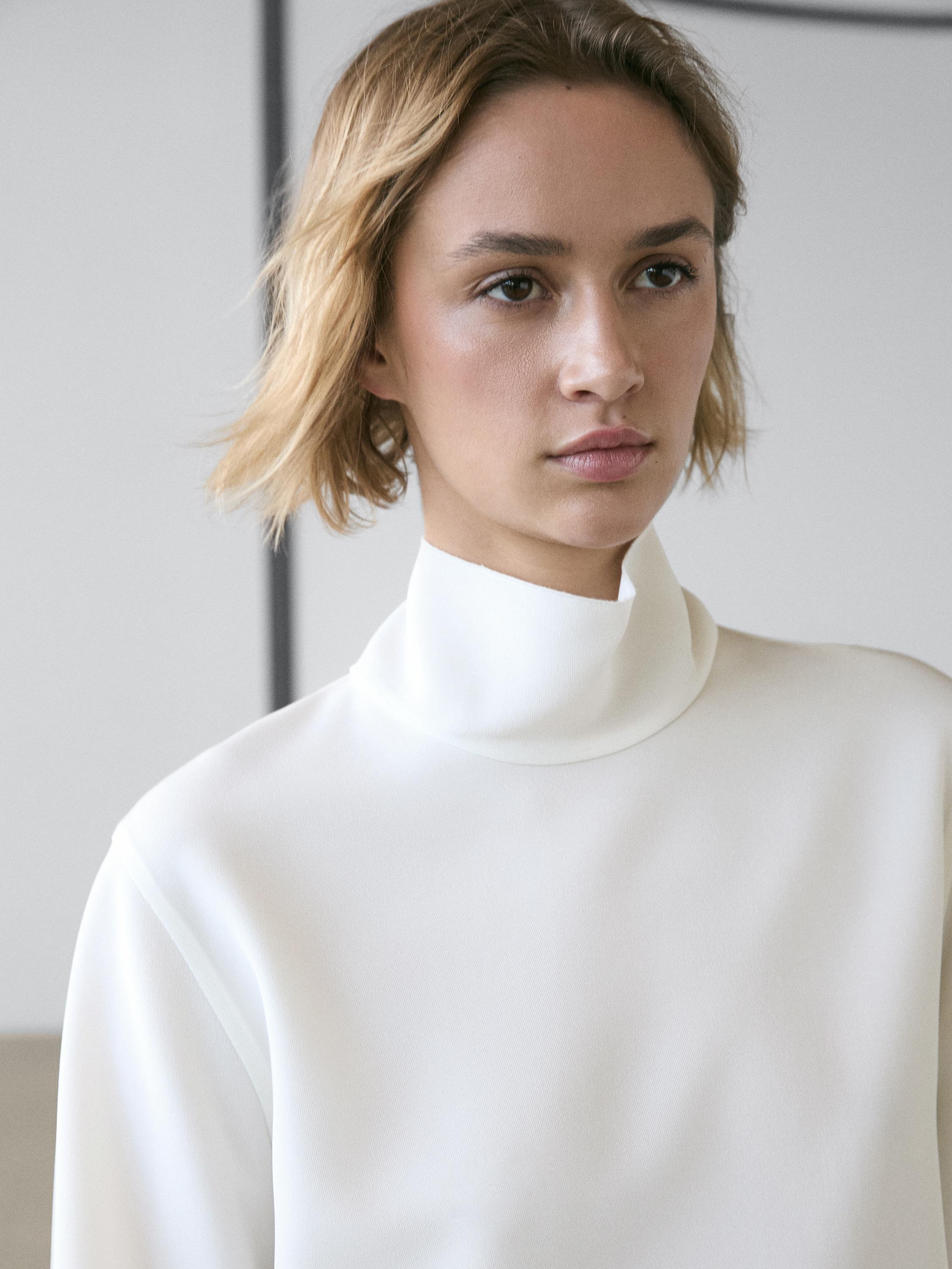 High neck blouse with hem detail