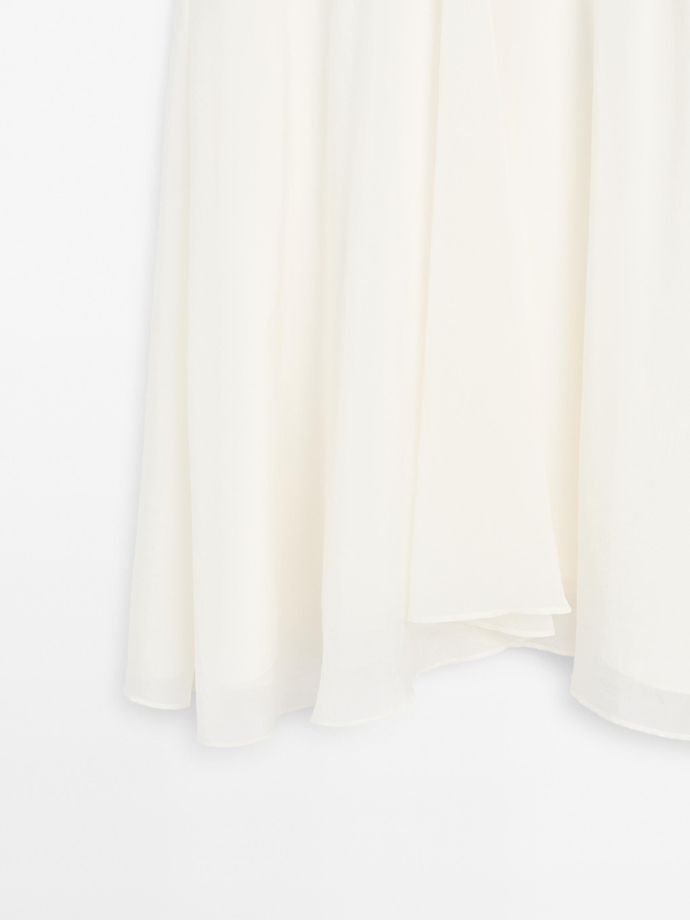 Jupe midi ample en maille côtelée