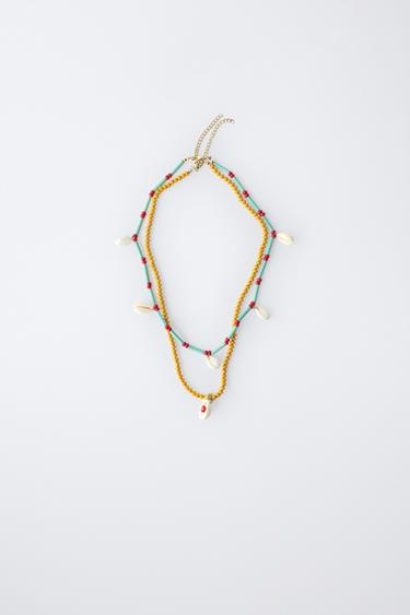 PAKKE MED TO HALSKÆDER MED PERLER OG SKALLER - turkis fra Zara - Billede 0