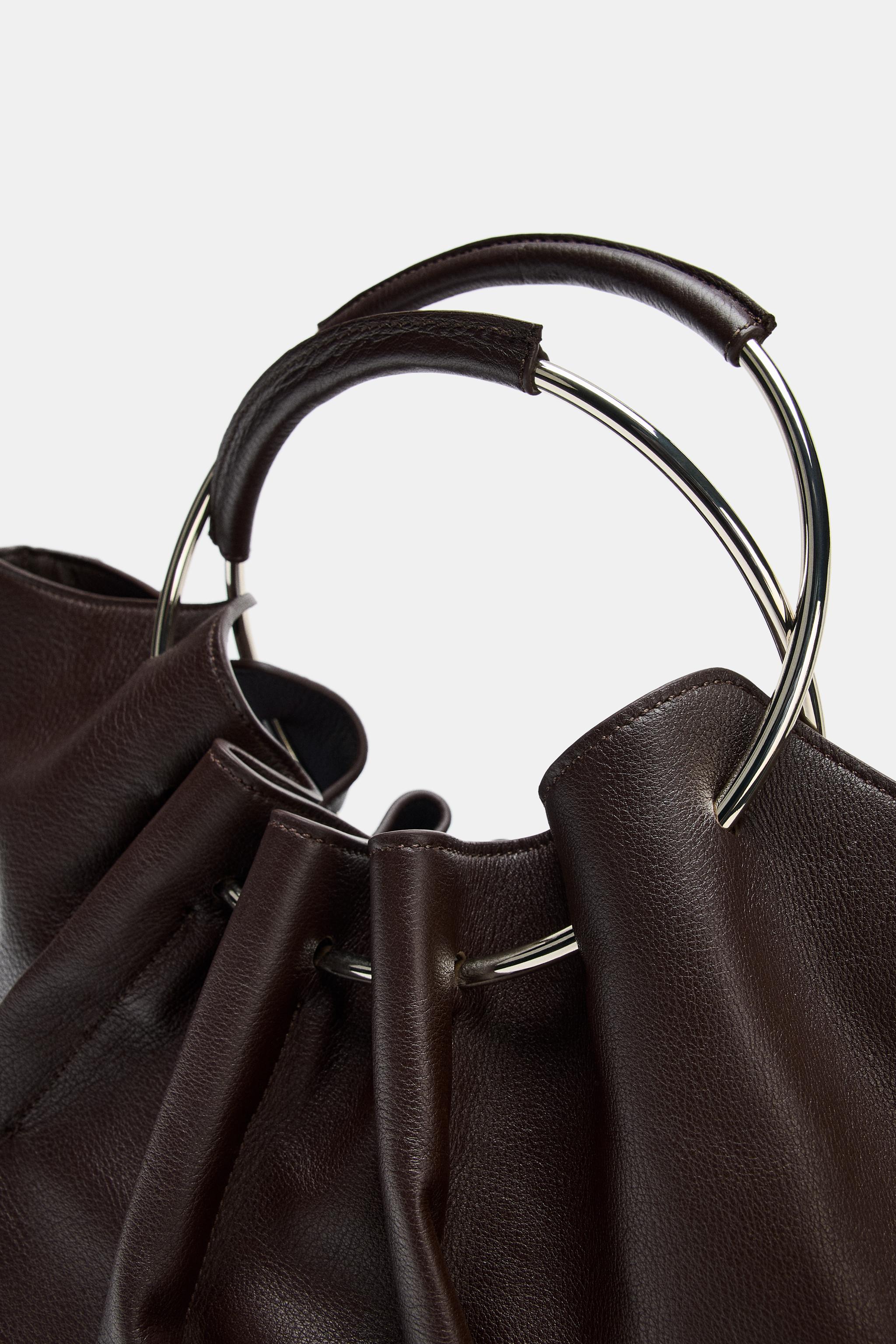 LEATHER BUCKET BAG WITH RIGID HANDLE