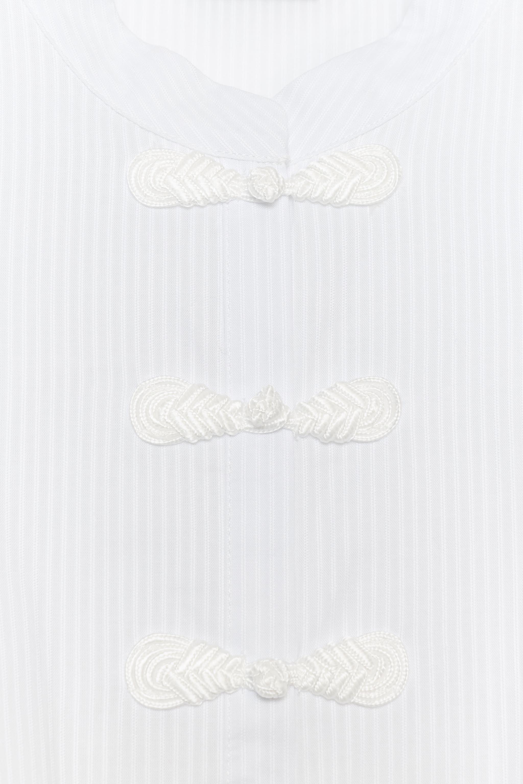 FROG FASTENING PEPLUM SHIRT