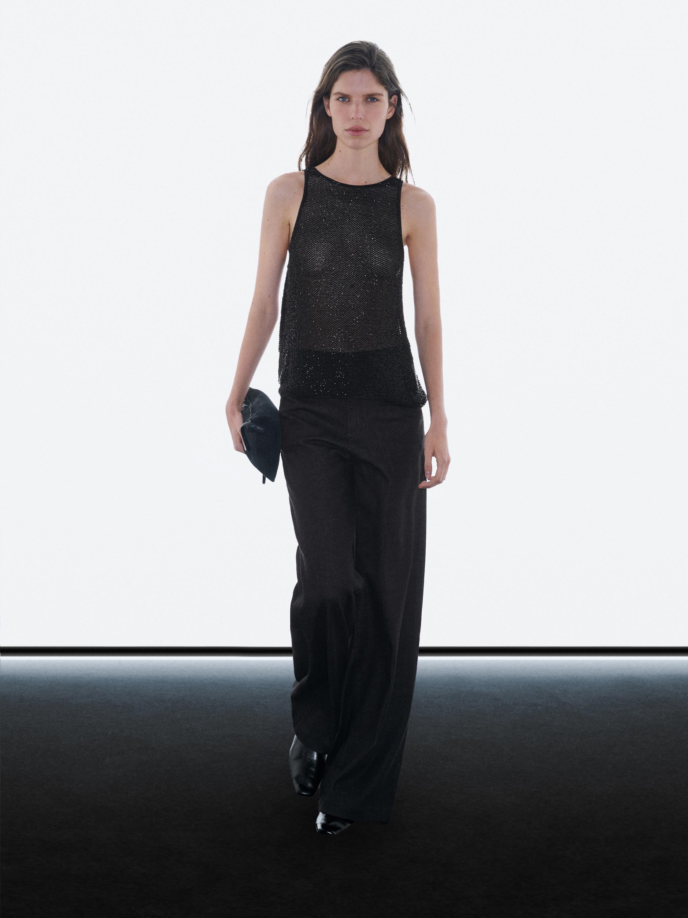 Semi-sheer top with matching beads