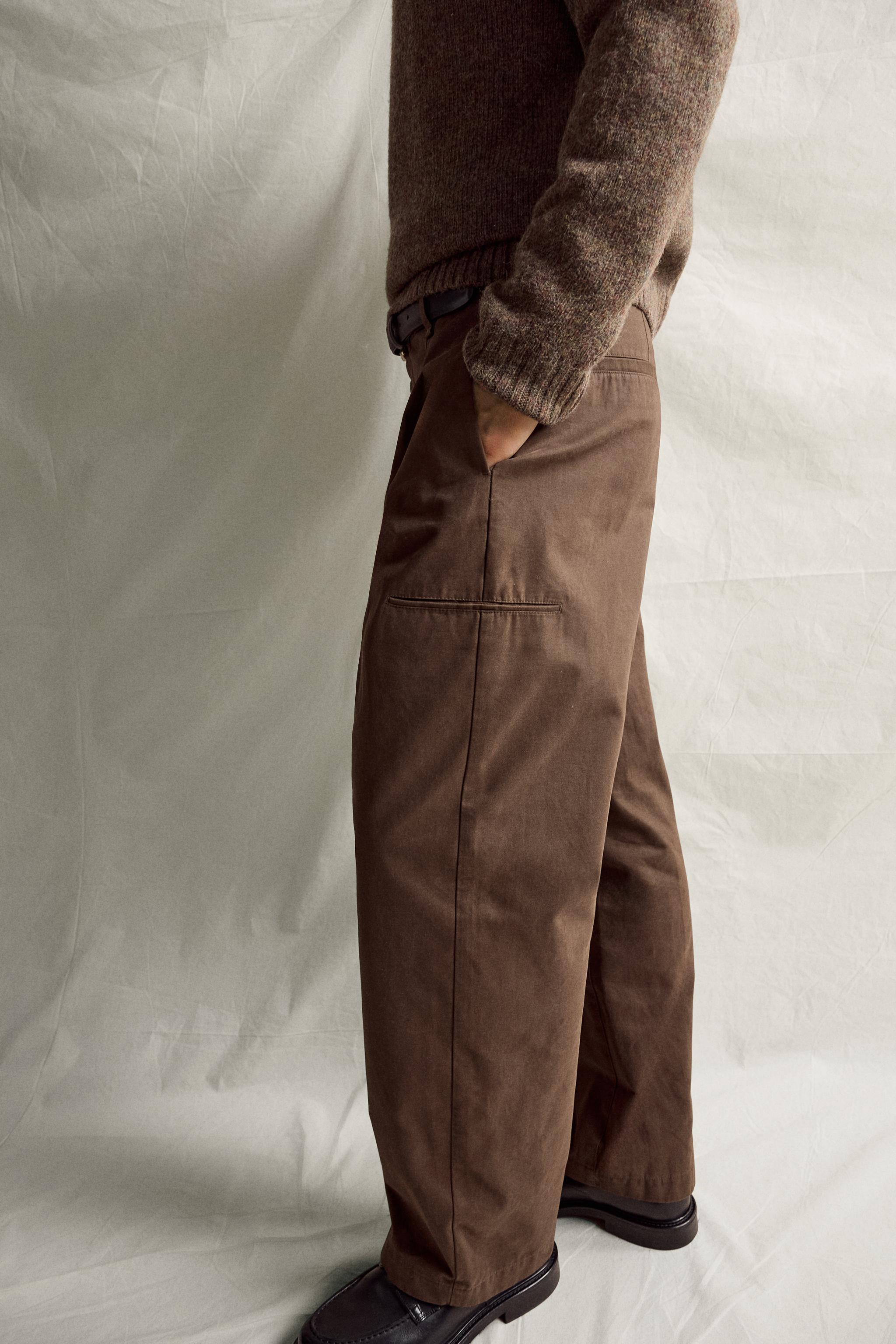 RELAXED FIT PLEATED PANTS