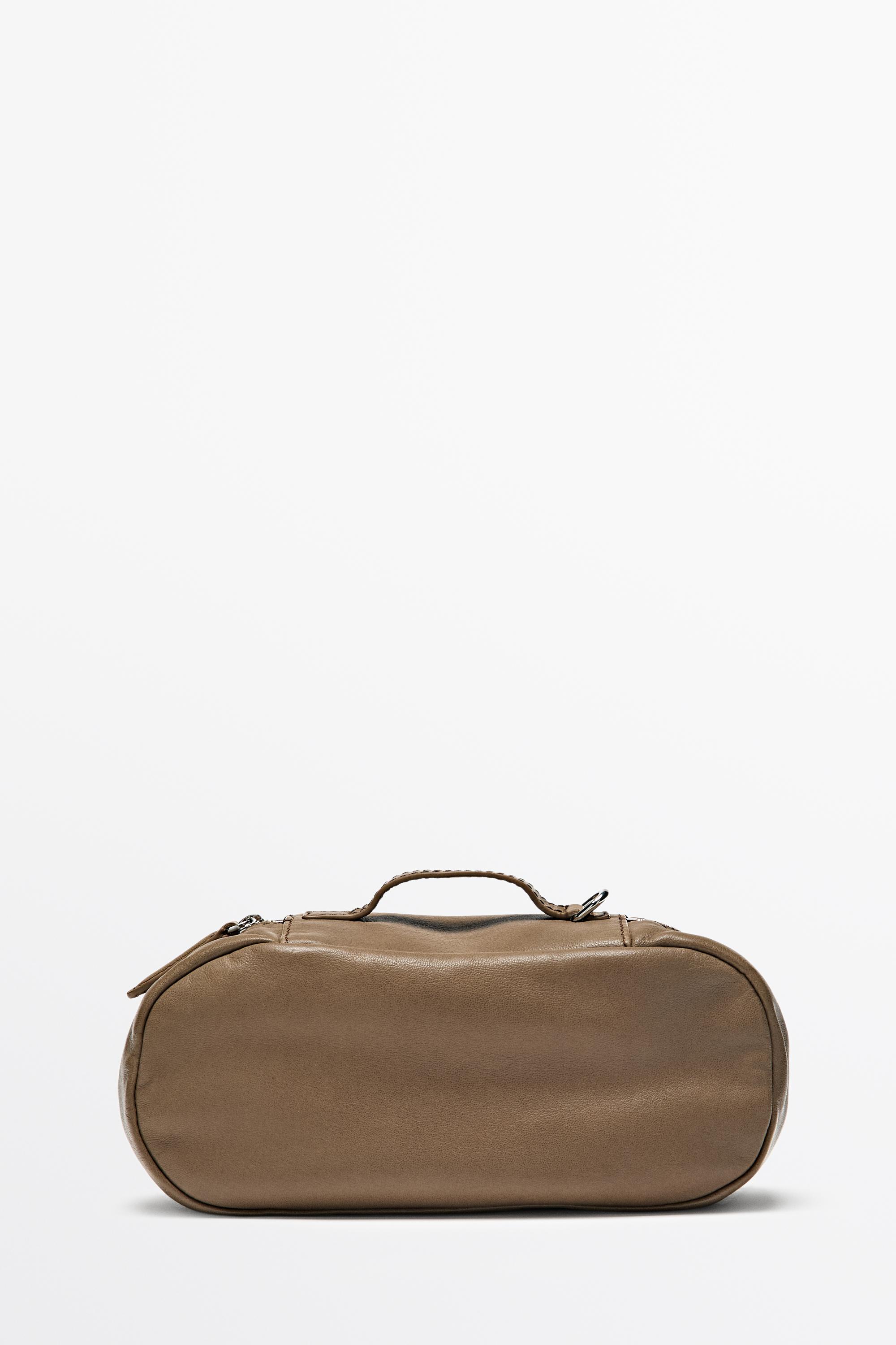 Oval nappa leather toiletry bag — Black gold