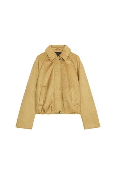 Front view of mustard bomber jacket with shirt collar, long sleeves, side pockets and front zip and button fastening.