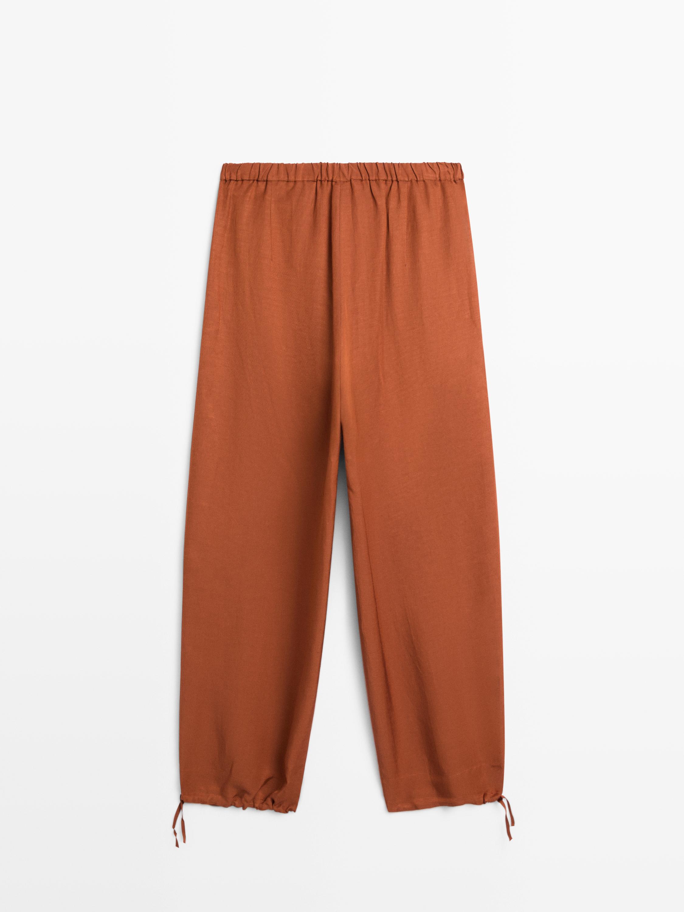 Flowing trousers with tie detail