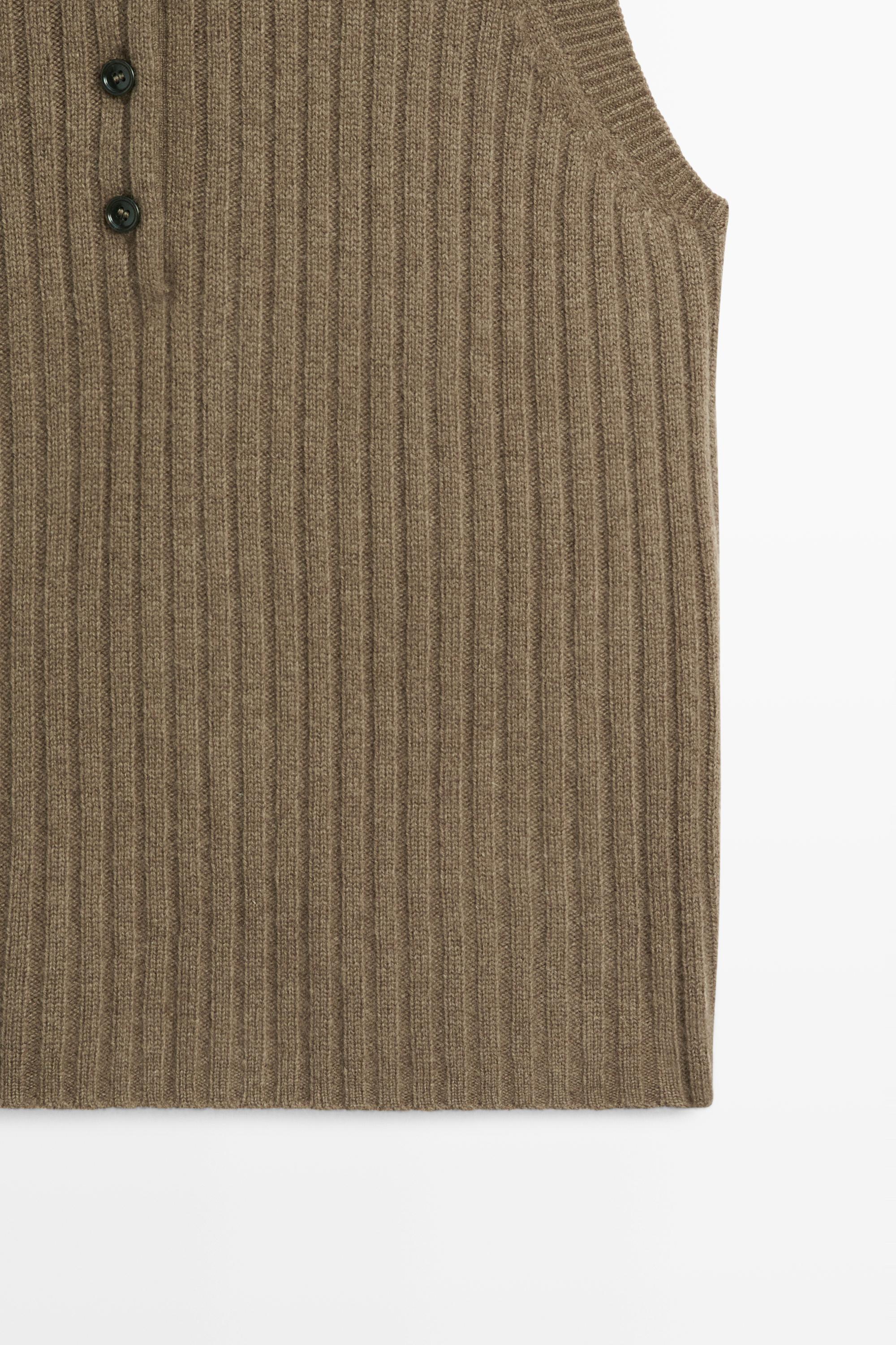 Knit vest with buttoned high neck