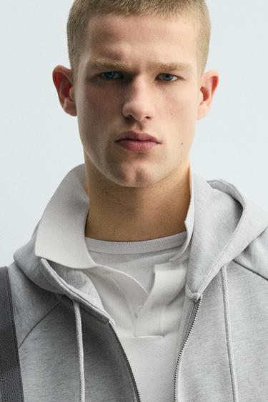 SZÖGLETES SZABÁSÚ KAPUCNIS MELEGÍTŐFELSŐ CIPZÁRRAL – Szürke cirmos a ZARA-tól