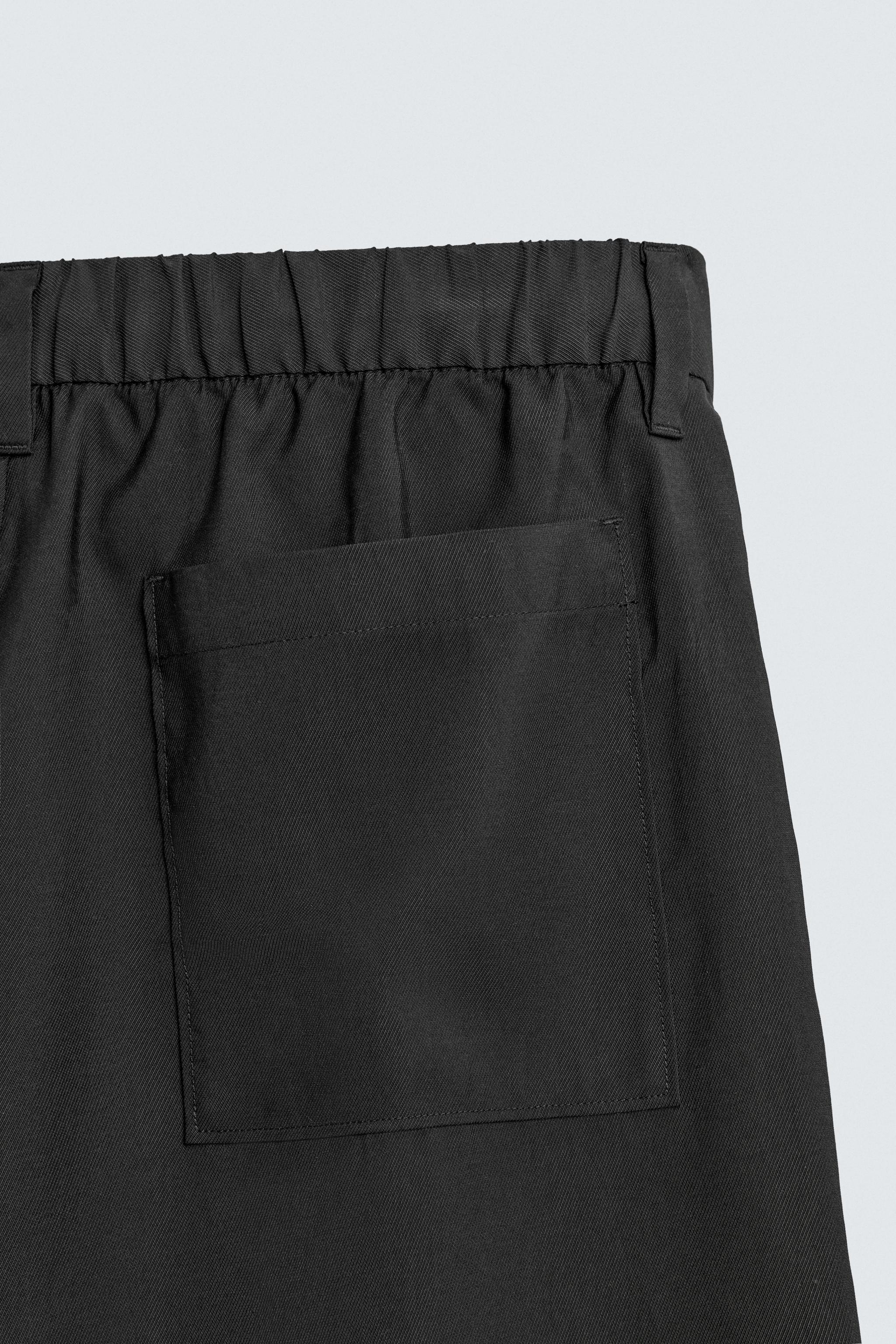 FLOWY PLEATED PANTS