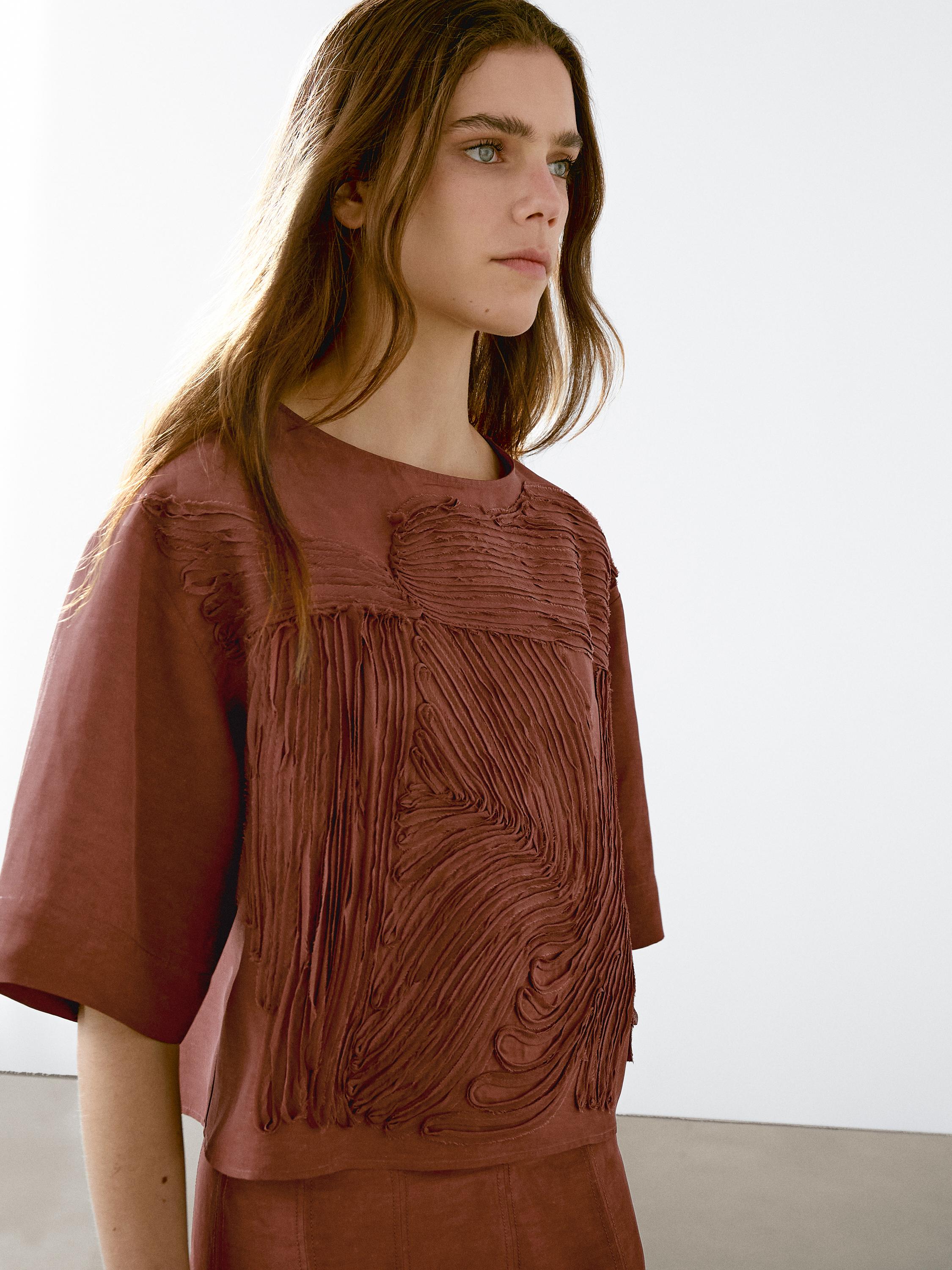 Flowing top with embroidered detail