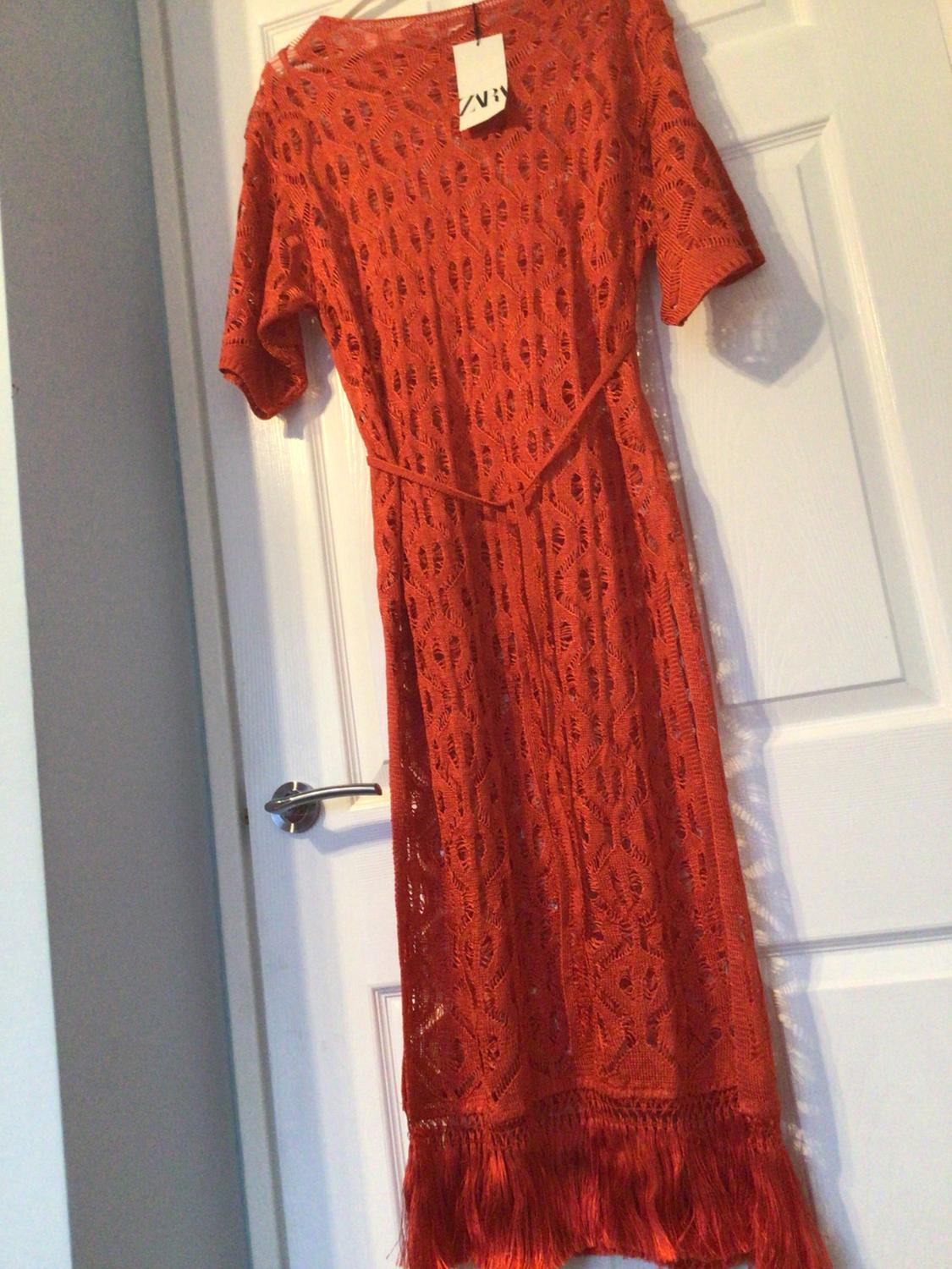 LONG OPEN-KNIT TUNIC WITH FRINGE