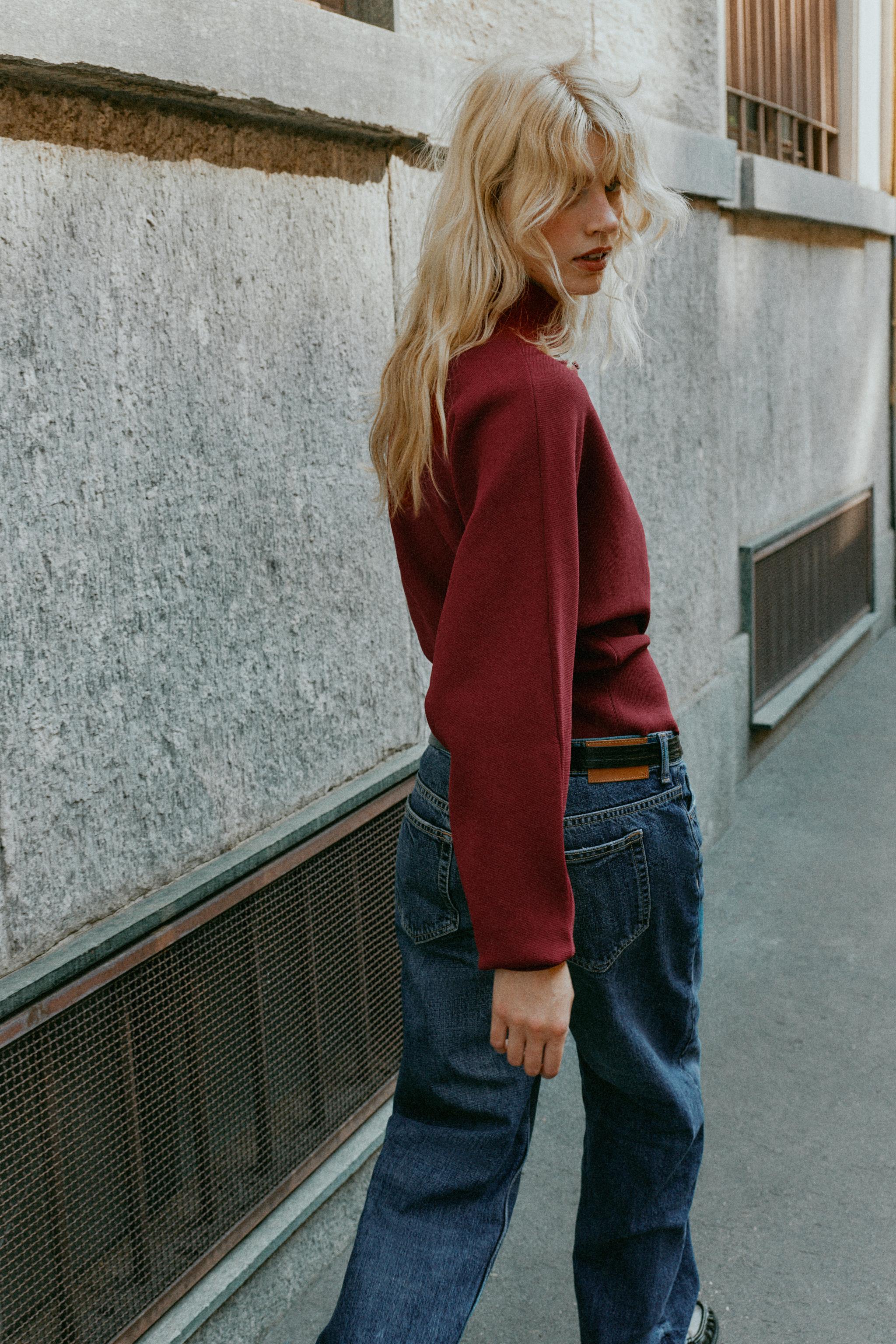 GILET EN MAILLE AVEC BOUTON REVÊTU