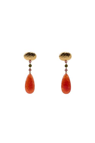 Gold-plated drop earrings with a red teardrop-shaped pendant and green and pink bead details.