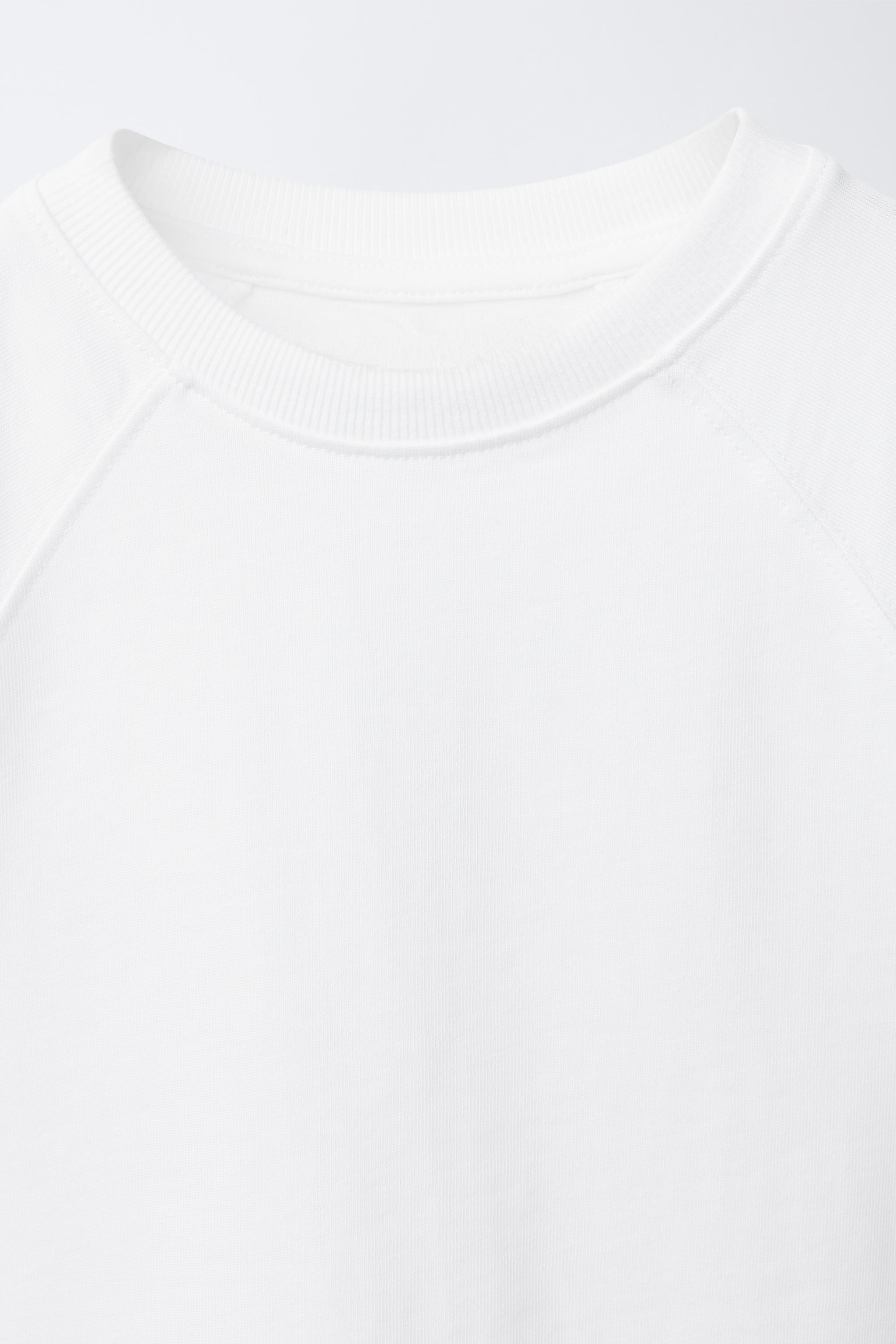 T-SHIRT UNI À MANCHES RAGLAN