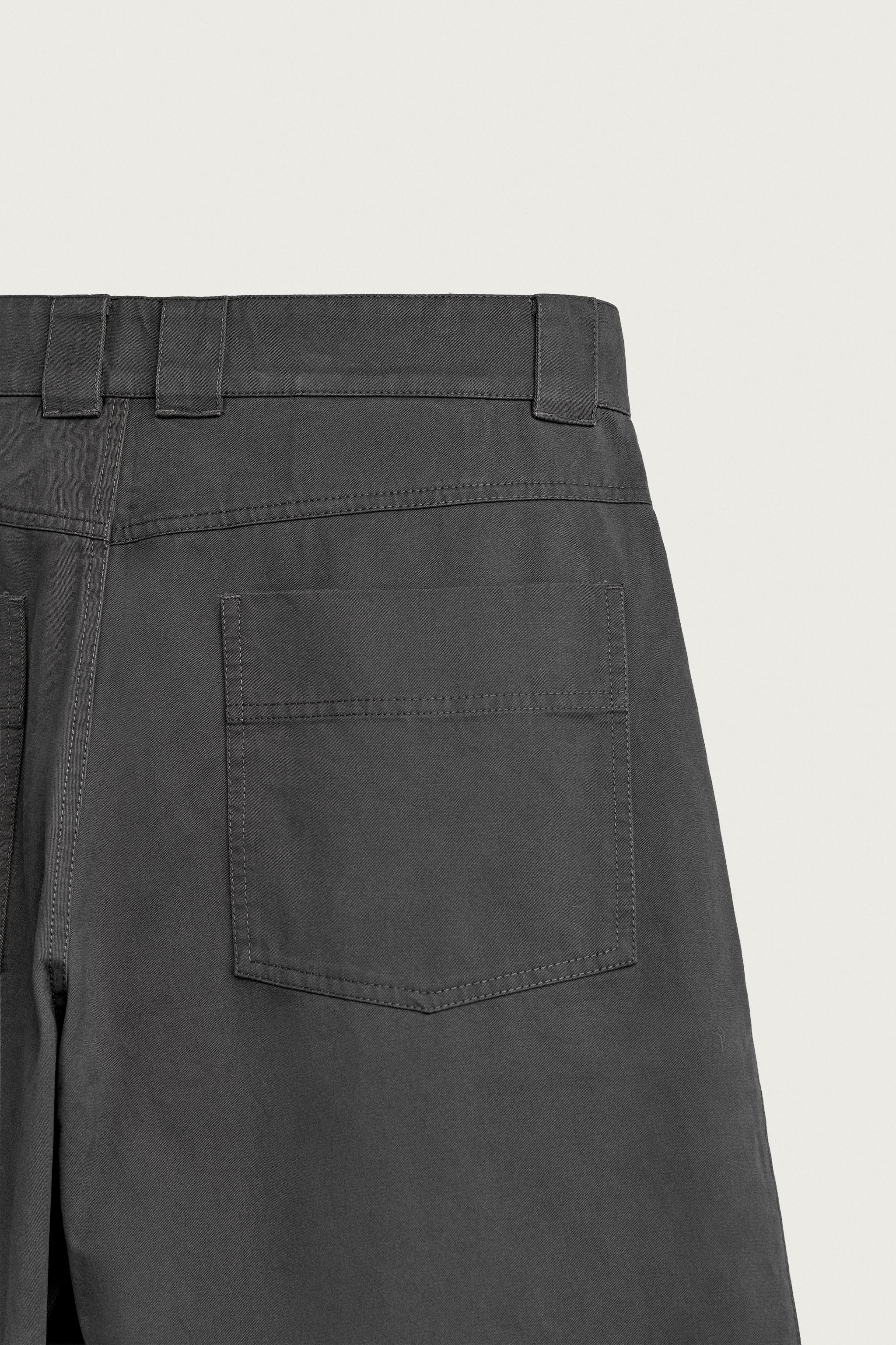 PLEATED WIDE FIT PANTS