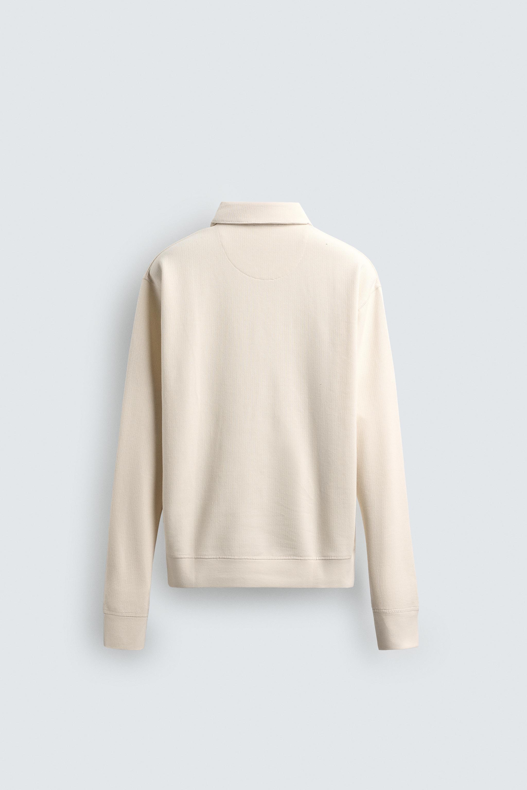 POLO STRUCTURÉ À ZIP