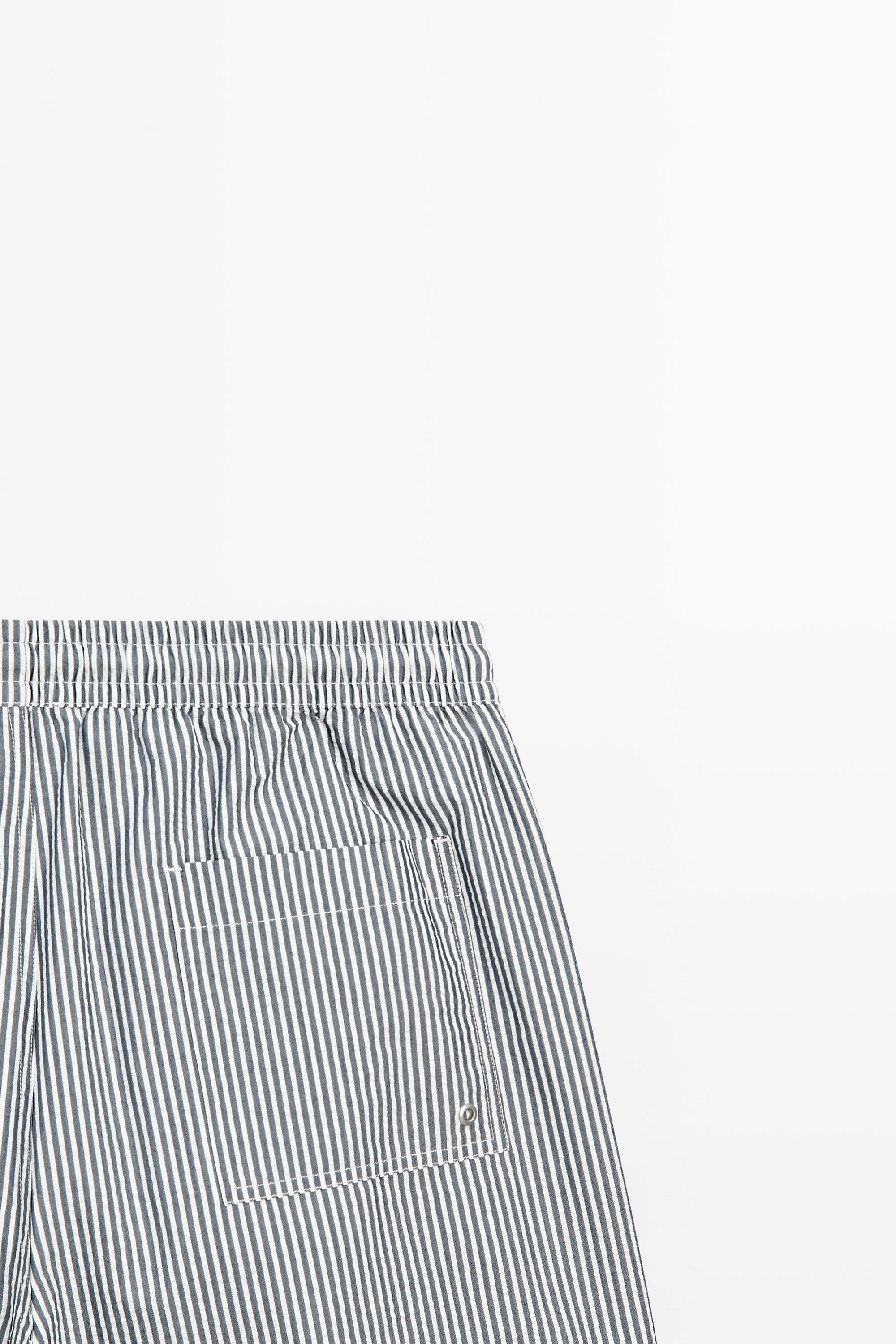 Swimming trunks with striped details