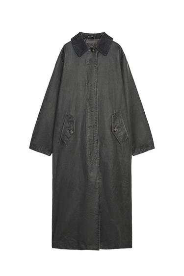 Front view of a long charcoal grey trench coat with a corduroy collar, long sleeves, side pockets, and concealed front fastening.