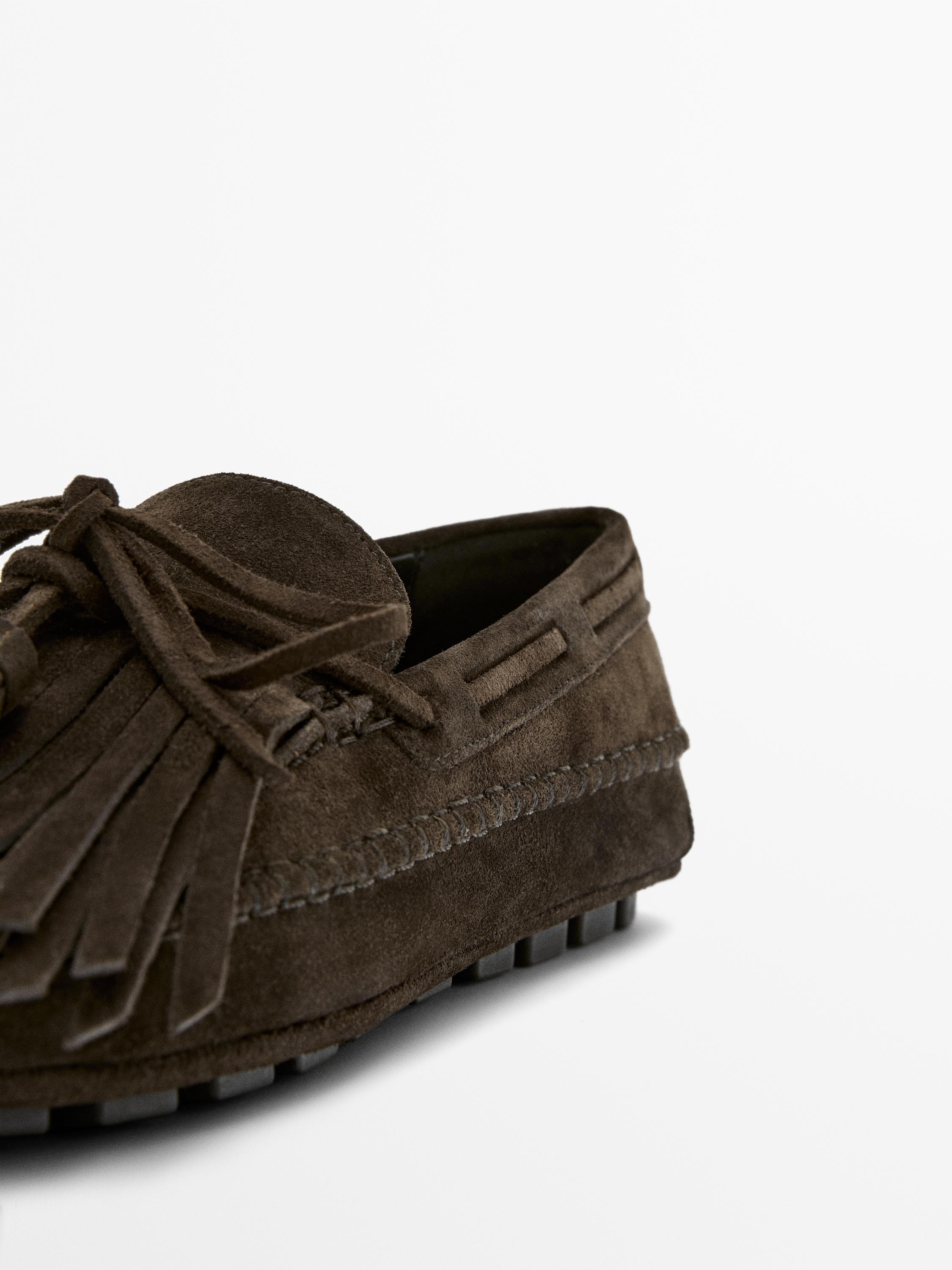 Mocassin à franges et pompons en croûte de cuir