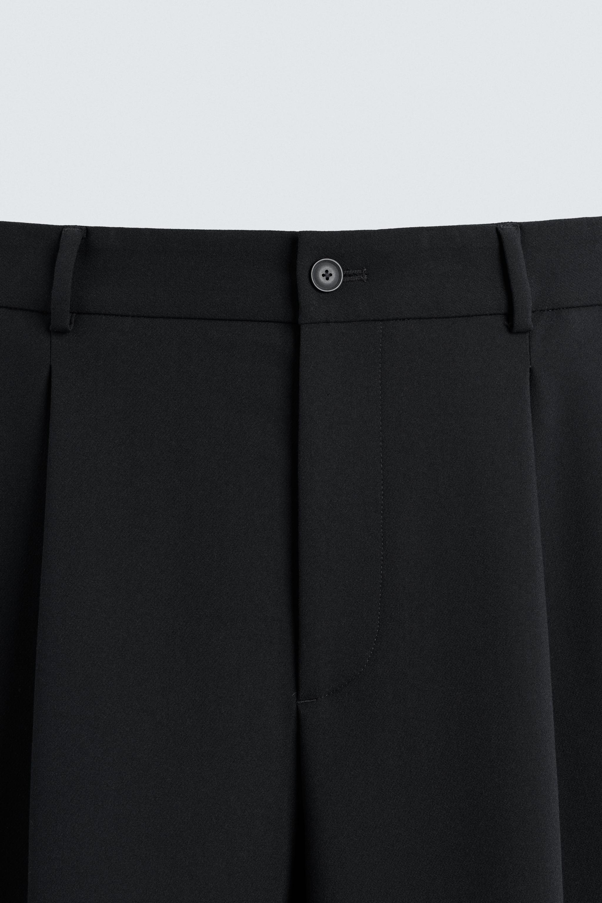 RELAXED FIT PLEATED PANTS