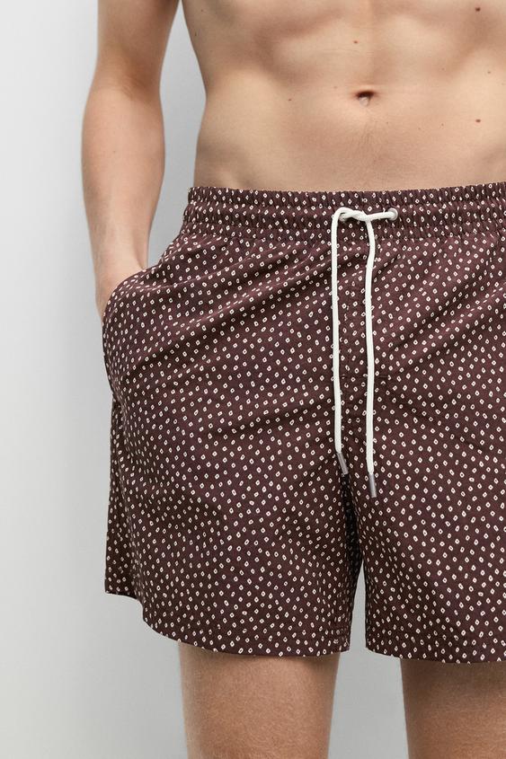 Polka dot print swimming trunks from Zara - $90
