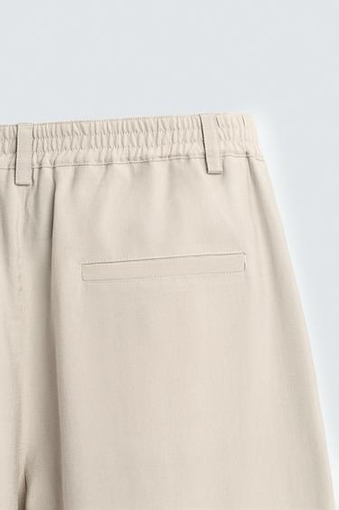 PANTALON FLUIDE À PLIS - Écru de Zara - Image 8