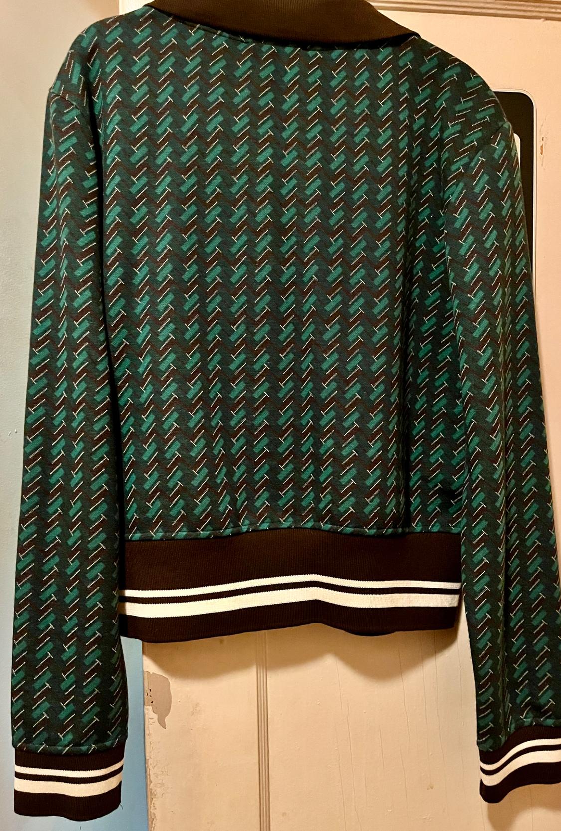 Polo with lapel collar and long sleeves. Rib trim. Front button closure. - Image 3