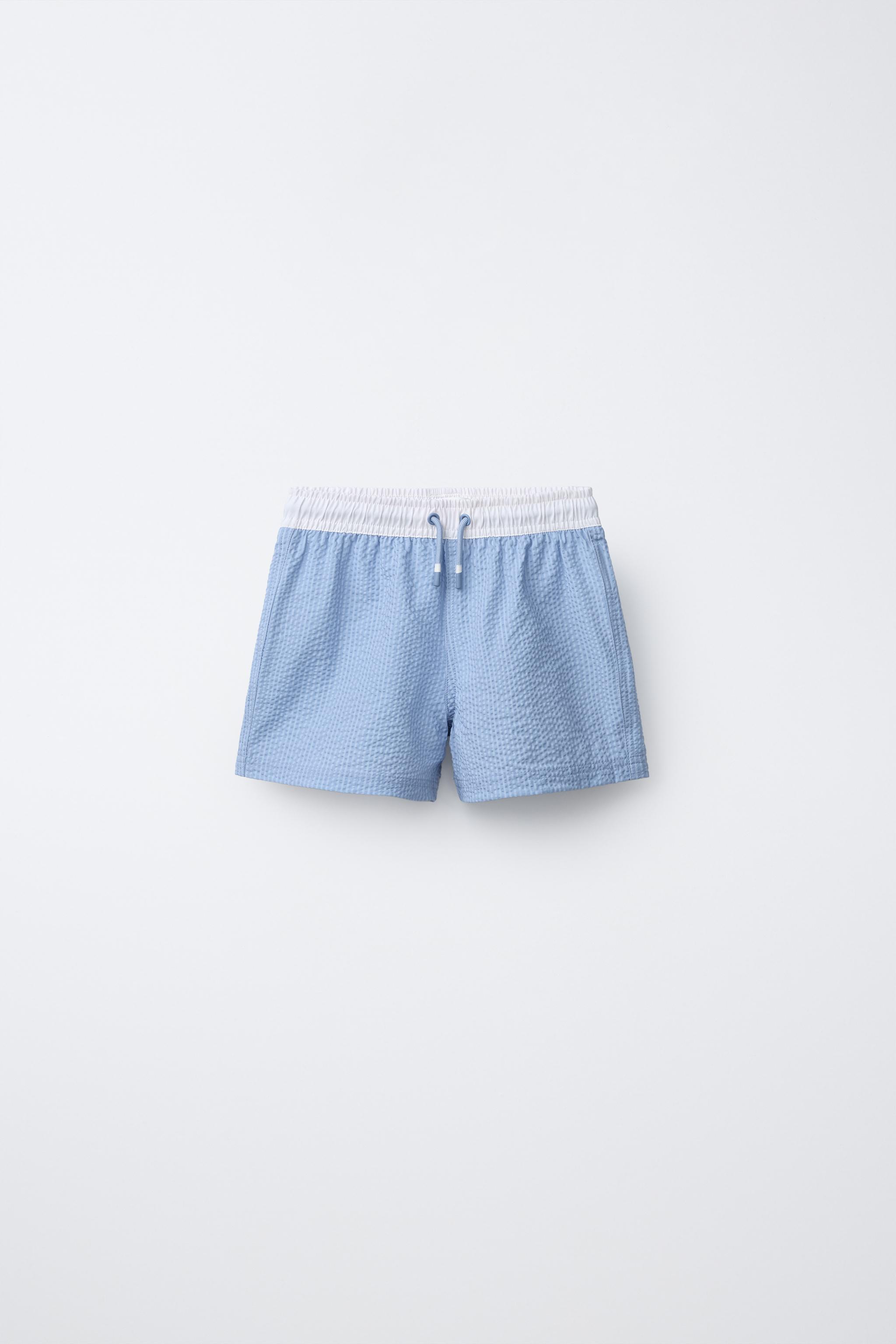 AGES 6-14 / LABEL SWIM SHORTS