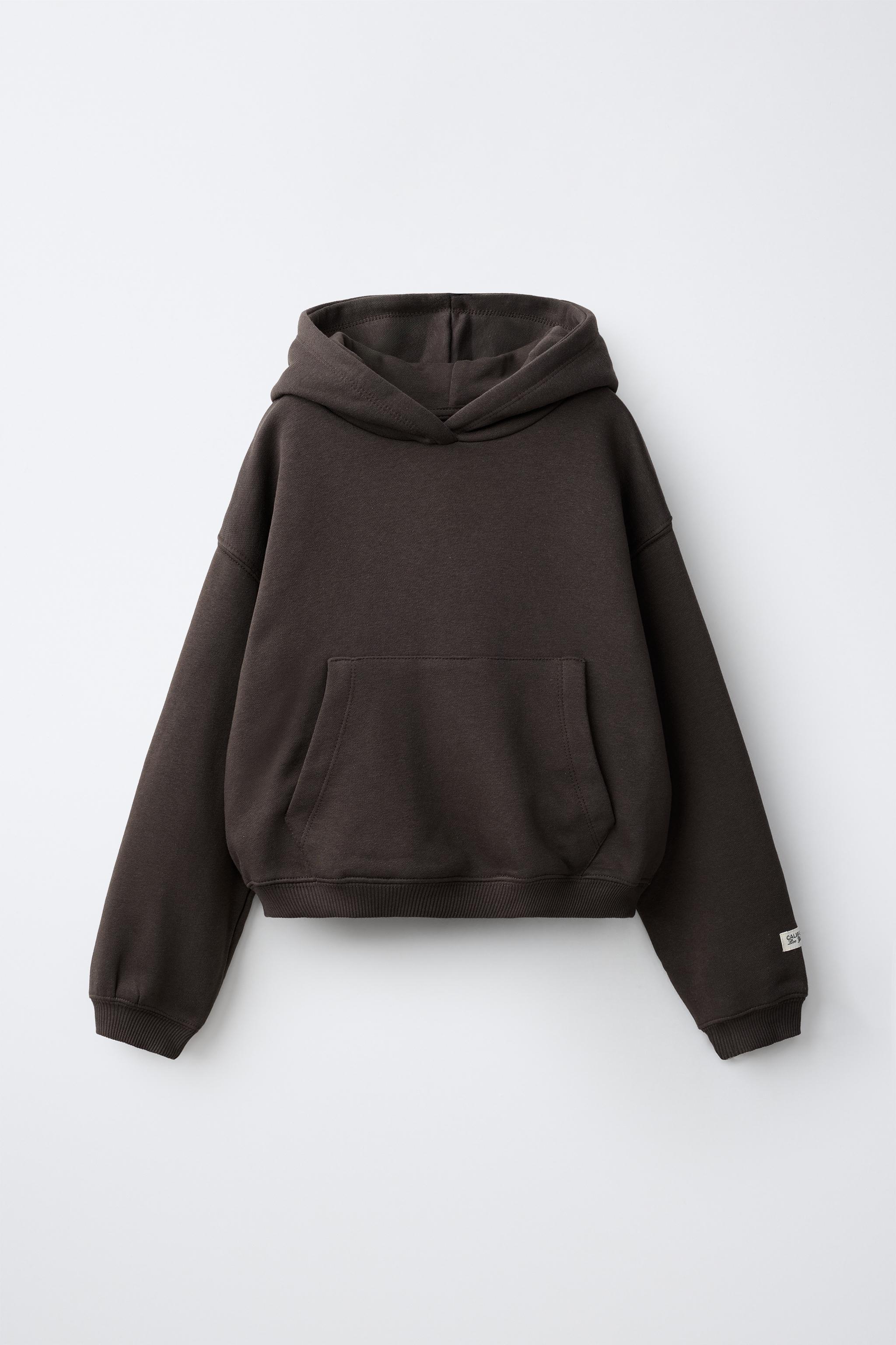 SWEAT À CAPUCHE ET ÉTIQUETTE