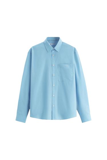 Front view of a light blue shirt with a front pocket and full button fastening.