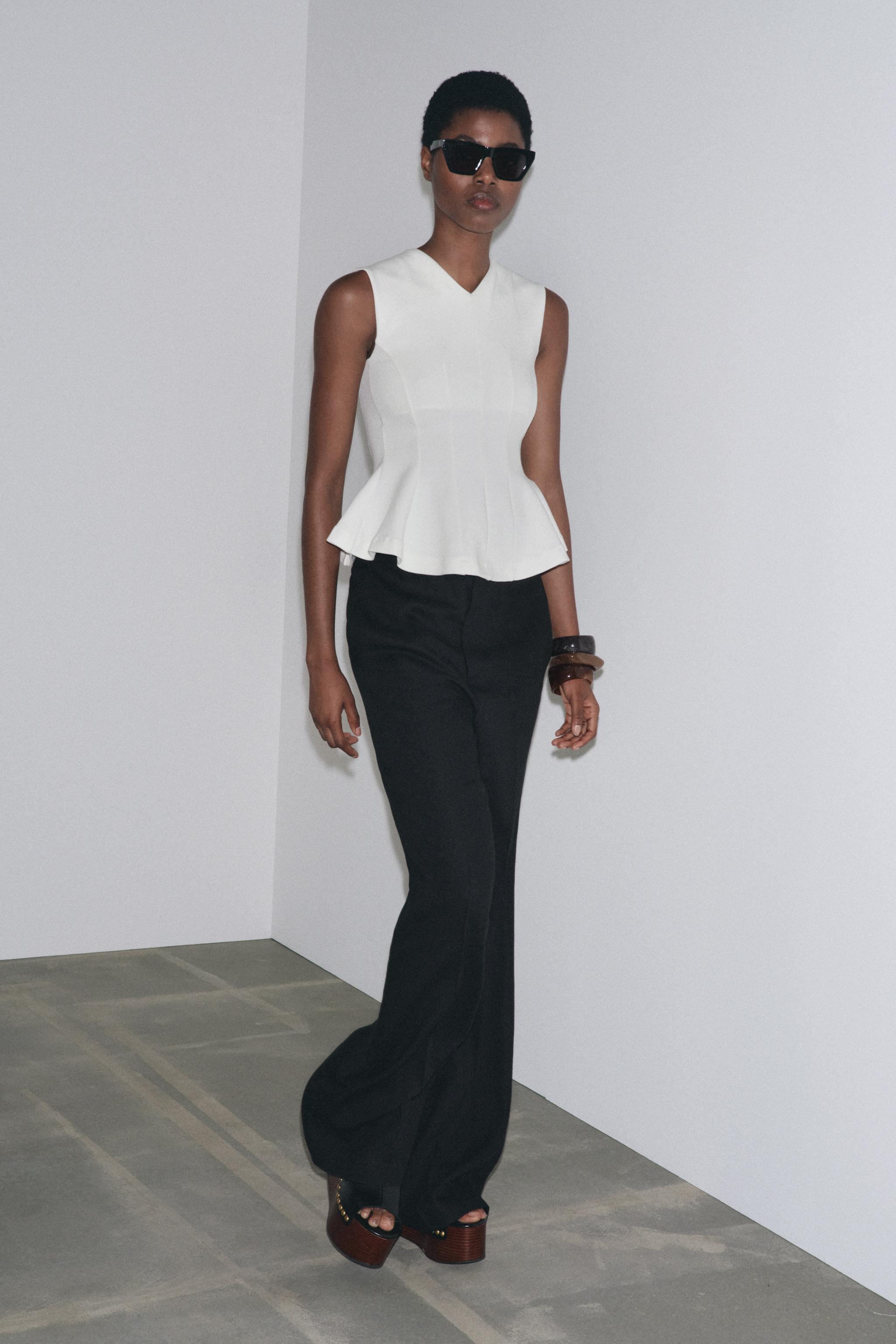 TOP INTERLOCK PÉPLUM SANS MANCHES