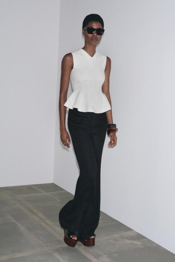 SLEEVELESS INTERLOCK PEPLUM TOP