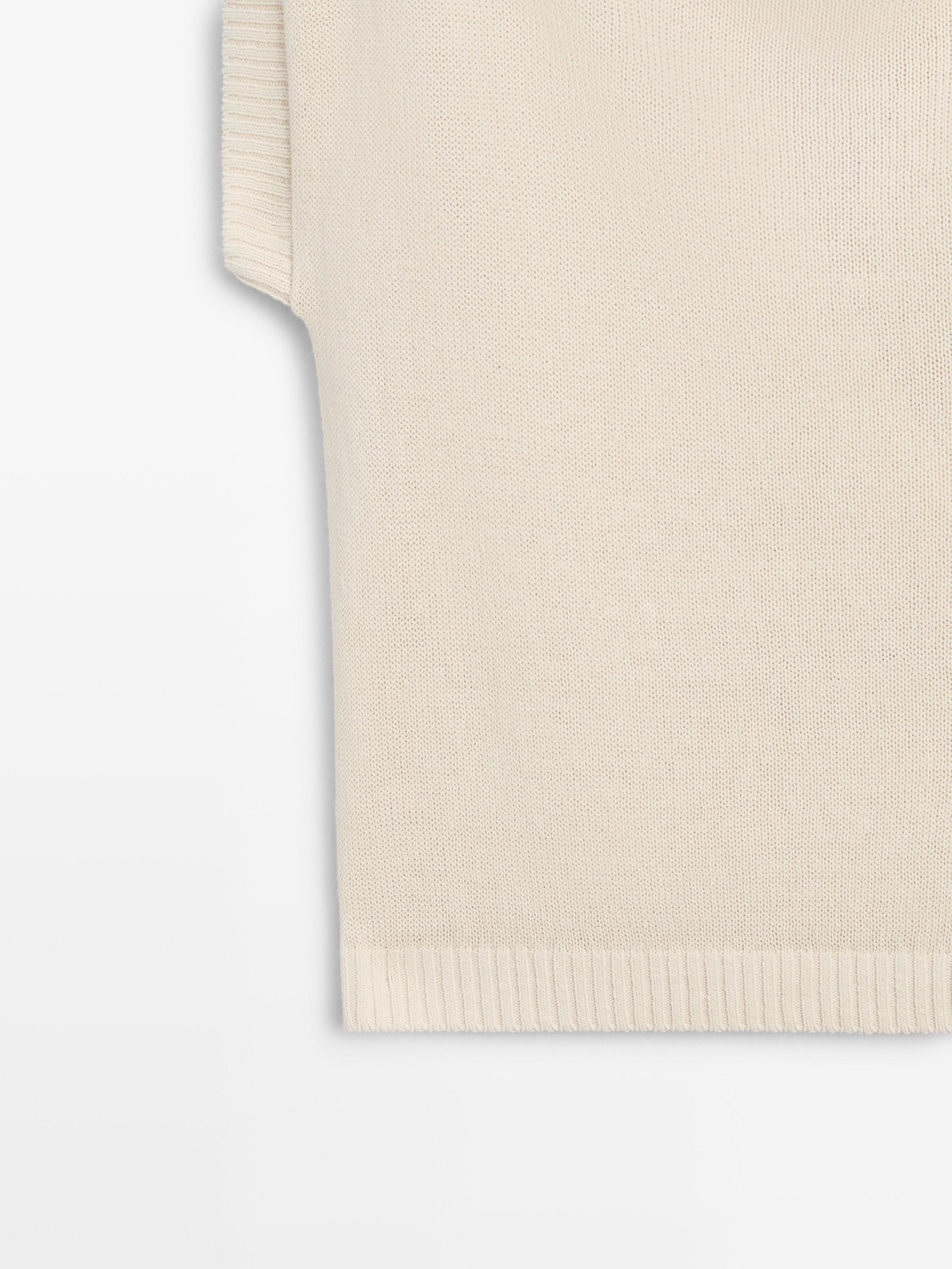Pull en maille à dos décolleté