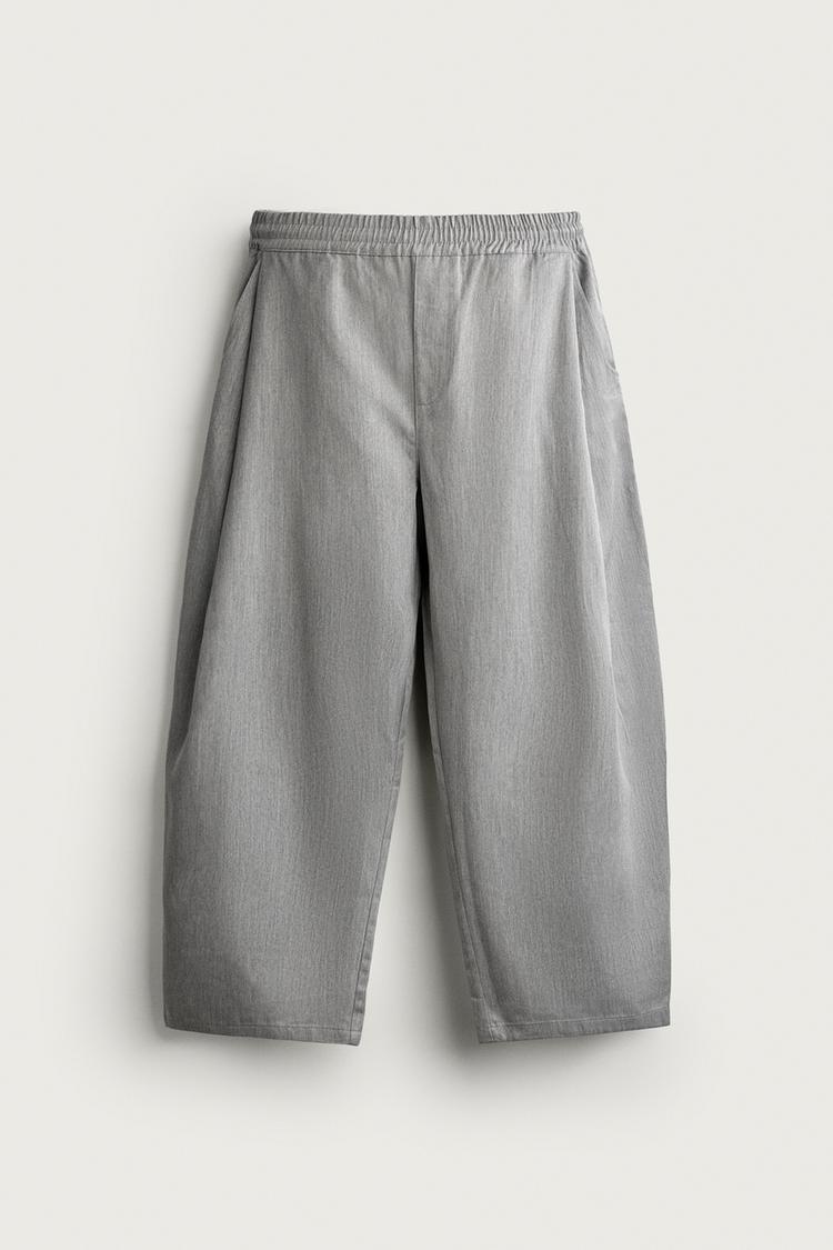 BALLOON FIT TROUSERS WITH SIDE PLEATS