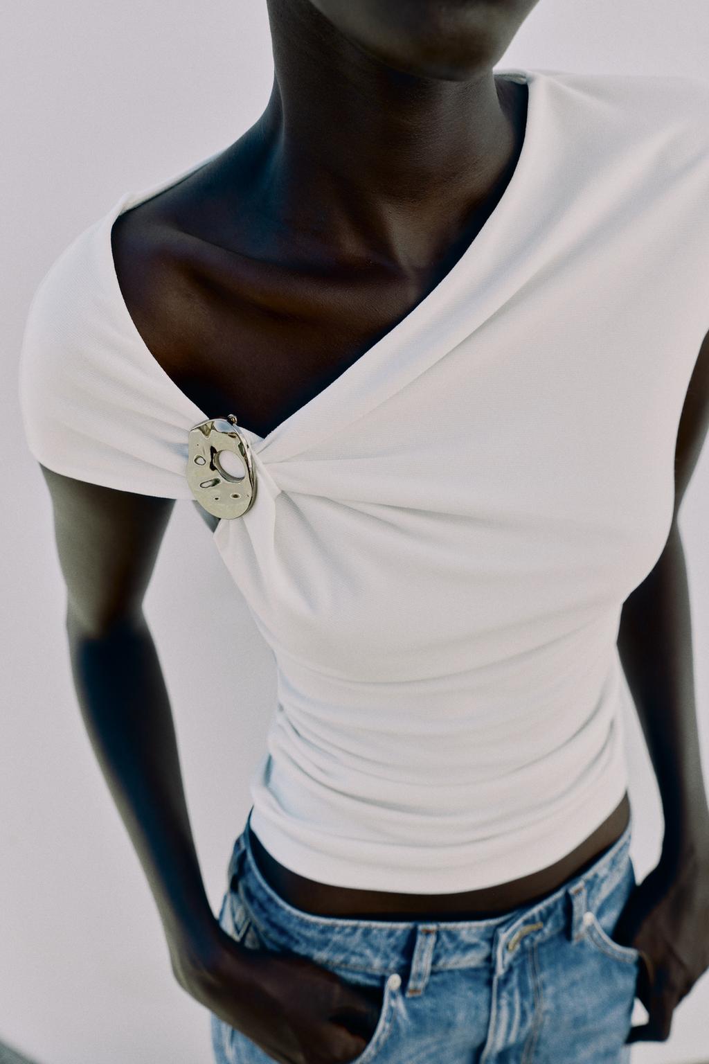 DRAPED TOP WITH EMBELLISHMENT