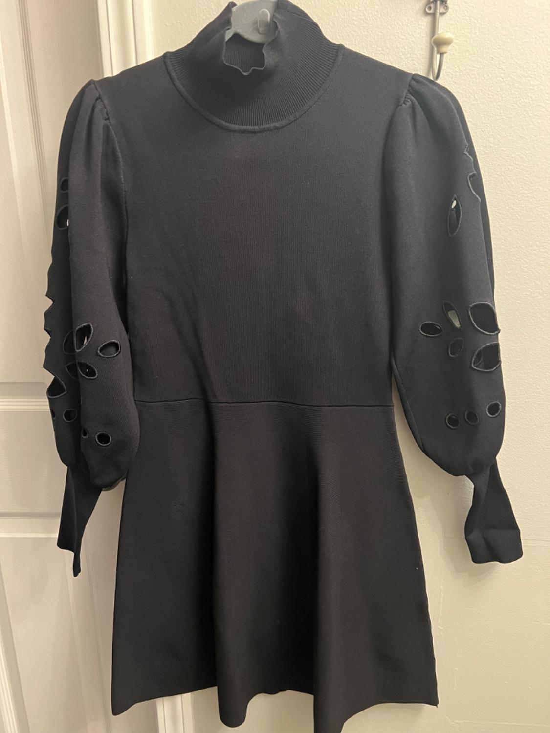 DRESS WITH OPENINGS AT SLEEVES