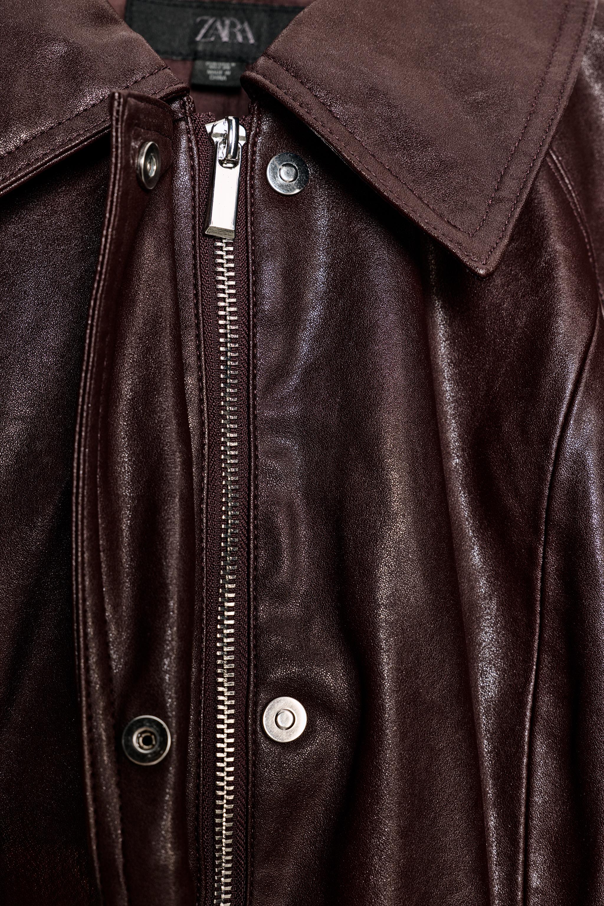VESTE À CEINTURE EN MATIÈRE SYNTHÉTIQUE